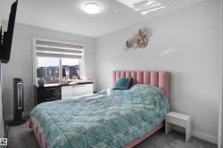 Bright room with a large window featuring horizontal blinds - 