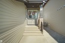Dual entry doors with upper window panels - 4003 39 Street, Beaumont, AB  - Outdoor With Exterior 