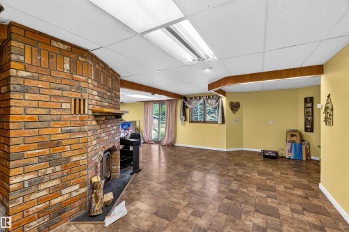 #35 53504 Rge Road 280, Rural Parkland County, AB - Indoor Photo Showing Other Room With Fireplace