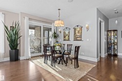 Dining space with dark wood-style flooring and a textured ceiling - 