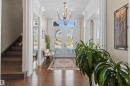 Entrance foyer featuring french doors, stairway, a chandelier, dark wood-style floors, and a textured ceiling - 2796 Wheaton Drive Nw, Edmonton, AB  - Indoor Photo Showing Other Room 