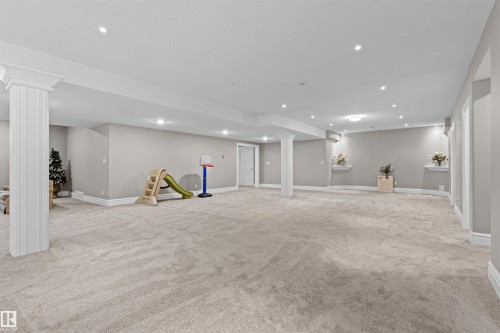 Finished below grade area featuring light colored carpet and recessed lighting - 2796 Wheaton Drive Nw, Edmonton, AB - Indoor