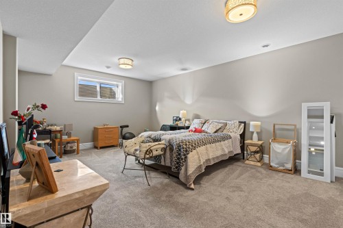 Bedroom featuring light colored carpet and baseboards - 2796 Wheaton Drive Nw, Edmonton, AB - Indoor Photo Showing Bedroom