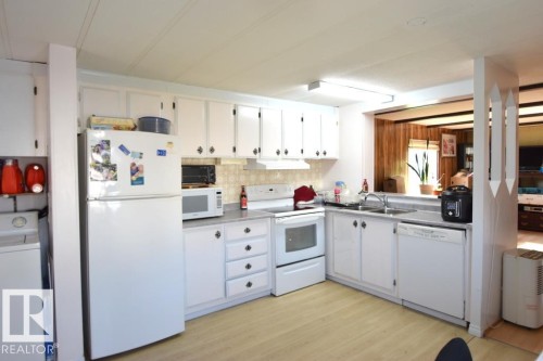 5222 3Rd Avenue, Boyle, AB - Indoor Photo Showing Kitchen With Double Sink