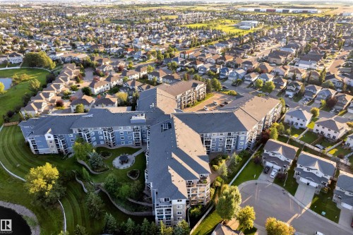 Multi-story residential complex featuring a tiered landscaping design and multiple private balconies - #136 16035 132 St Nw, Edmonton, AB - Outdoor With View