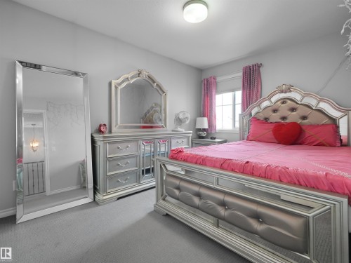 Light grey wall color throughout - 1716 60 Street Sw, Edmonton, AB - Indoor Photo Showing Bedroom