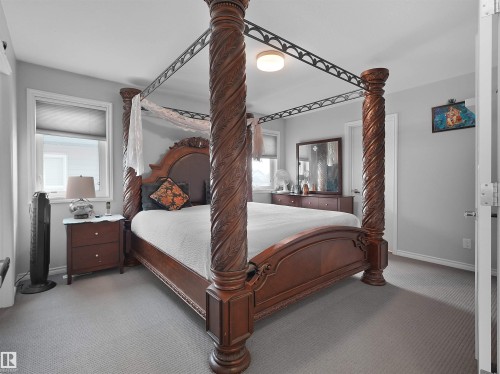 Wall-to-wall carpeting in a neutral tone - 1716 60 Street Sw, Edmonton, AB - Indoor Photo Showing Bedroom