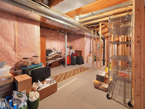 Unfinished basement area featuring exposed wood framing, ceiling joists, and floor joists - 1716 60 Street Sw, Edmonton, AB - Indoor Photo Showing Basement
