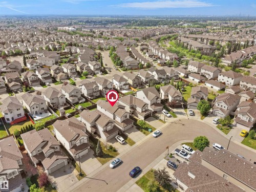 Aerial view showcasing a residential neighborhood with detached homes, consistent rooflines, and a structured street layout - 1716 60 Street Sw, Edmonton, AB - Outdoor With View