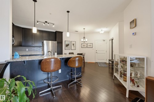 #110 6083 Maynard Wy Nw, Edmonton, AB - Indoor Photo Showing Kitchen With Upgraded Kitchen
