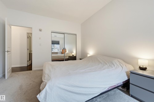 #110 6083 Maynard Wy Nw, Edmonton, AB - Indoor Photo Showing Bedroom