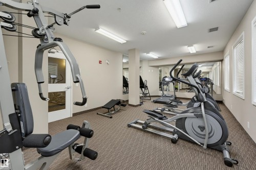 #110 6083 Maynard Wy Nw, Edmonton, AB - Indoor Photo Showing Gym Room