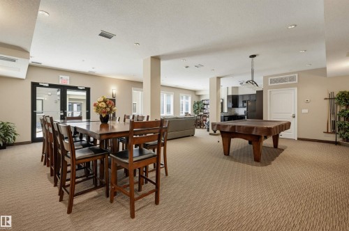 #110 6083 Maynard Wy Nw, Edmonton, AB - Indoor Photo Showing Dining Room