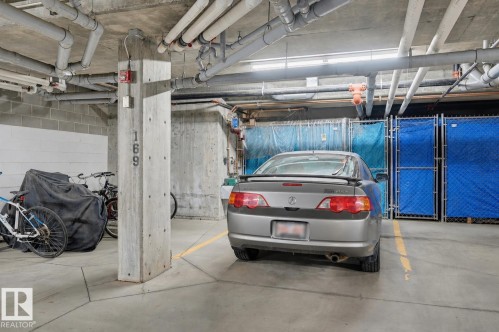 #110 6083 Maynard Wy Nw, Edmonton, AB - Indoor Photo Showing Garage