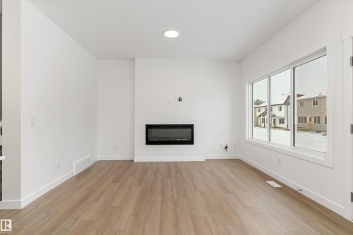 919 19 Avenue Nw, Edmonton, AB - Indoor Photo Showing Living Room With Fireplace