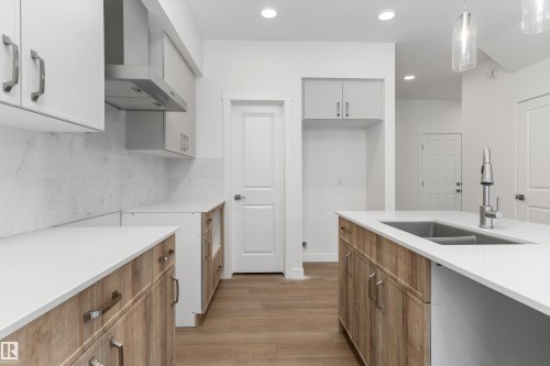 919 19 Avenue Nw, Edmonton, AB - Indoor Photo Showing Kitchen With Double Sink