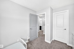 Neutral gray walls with white trim and gray carpeting - 