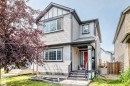 Two-story home featuring light-colored siding with dark trim accents - 17508 58 Street Nw, Edmonton, AB  - Outdoor 