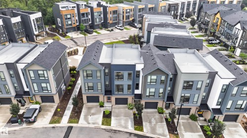Modern townhome community featuring contemporary architectural designs - #84 1304 Rutherford Rd Sw, Edmonton, AB -  With Facade