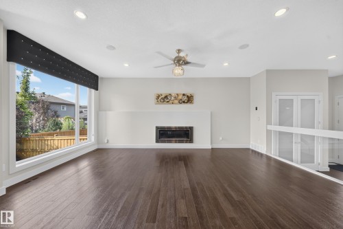 1116 Hainstock Green Sw, Edmonton, AB - Indoor Photo Showing Living Room With Fireplace