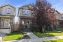 Gray siding exterior with dark trim accents and stone detailing - 12305 173A Avenue Nw, Edmonton, AB  - Outdoor With Facade 