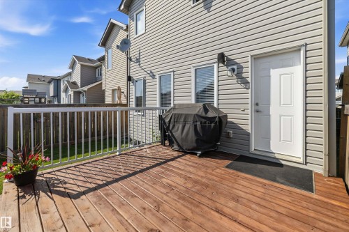Spacious wood deck featuring a white railing system - 12305 173A Avenue Nw, Edmonton, AB - Outdoor With Deck Patio Veranda With Exterior