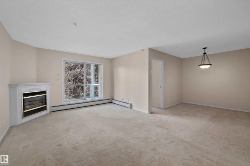 #207 911 Rabbit Hill Rd Nw, Edmonton, AB - Indoor With Fireplace