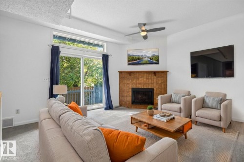 1501 Lakeside Green, St. Albert, AB - Indoor Photo Showing Living Room With Fireplace