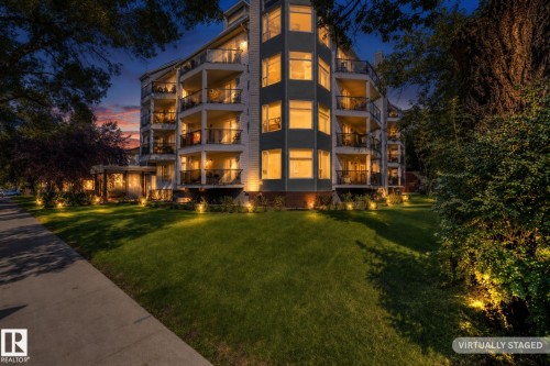 Multi-story residential building featuring multiple private balconies with glass railings - #206, 9905 112 St Nw, Edmonton, AB - Outdoor With Facade