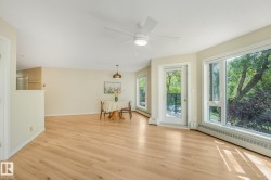Light-toned laminate flooring extending throughout the open area - 