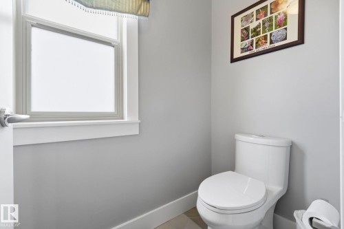 Bathroom featuring a white toilet, light gray walls, and white trim - 3 Garneau Gate, Spruce Grove, AB - Indoor Photo Showing Bathroom