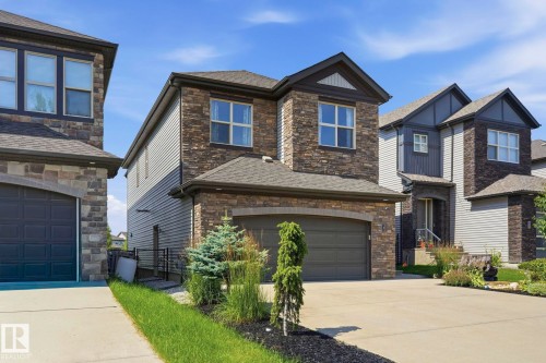 Contemporary two-story residence featuring a stone and siding exterior - 3 Garneau Gate, Spruce Grove, AB - Outdoor With Facade