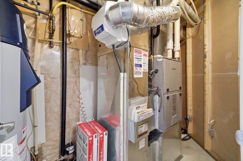 Dedicated utility space featuring a furnace, water heater, and humidifier - 3 Garneau Gate, Spruce Grove, AB - Indoor Photo Showing Basement