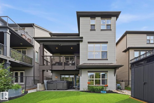 Rear exterior showcasing a multi-level design with light grey siding - 3 Garneau Gate, Spruce Grove, AB - Outdoor