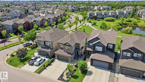 Contemporary two-story residence with a stone and siding exterior, featuring an attached garage and a concrete driveway - 3 Garneau Gate, Spruce Grove, AB - Outdoor