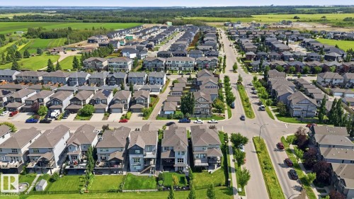 Aerial perspective showcasing a residential community with diverse single-family homes - 3 Garneau Gate, Spruce Grove, AB - Outdoor With View