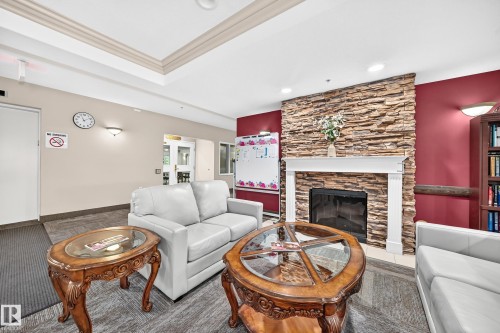 #421 14259 50 St Nw, Edmonton, AB - Indoor Photo Showing Living Room With Fireplace