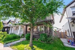 Two-story residence featuring a covered front porch, light gray siding, dark trim, and a concrete walkway - 