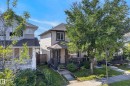 Two-story residence featuring light-toned siding with dark trim accents - 3003 20 Avenue Nw, Edmonton, AB  - Outdoor 