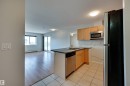 #430 4309 33 St, Stony Plain, AB  - Indoor Photo Showing Kitchen With Double Sink 