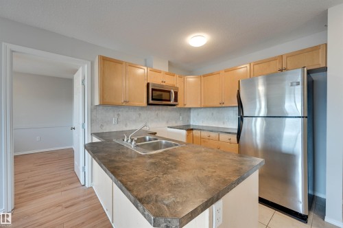 #430 4309 33 St, Stony Plain, AB - Indoor Photo Showing Kitchen With Double Sink