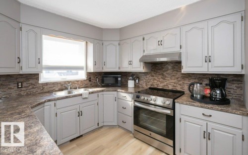10737 108A Avenue, Westlock, AB - Indoor Photo Showing Kitchen With Double Sink