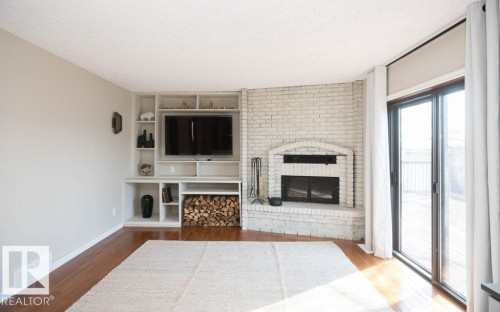 10737 108A Avenue, Westlock, AB - Indoor Photo Showing Other Room With Fireplace
