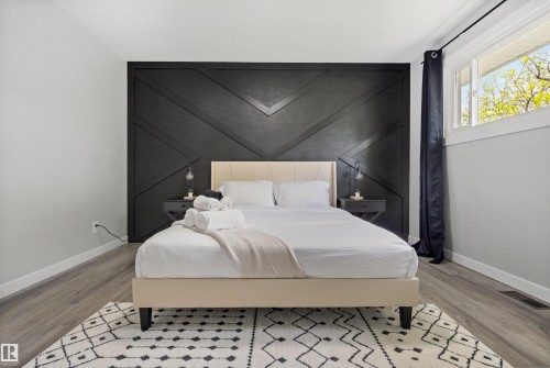 Accent wall featuring geometric paneling - 4001 113 Avenue Nw, Edmonton, AB - Indoor Photo Showing Bedroom