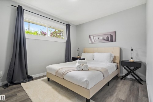 Bedroom featuring light gray walls and wood-finish flooring - 4001 113 Avenue Nw, Edmonton, AB - Indoor Photo Showing Bedroom