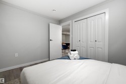 Light gray walls complement the wood-finish flooring - 