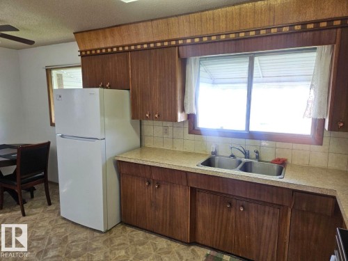 5024 50 Street, Andrew, AB - Indoor Photo Showing Kitchen With Double Sink