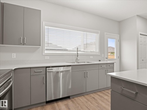 103 South Creek Wynd, Stony Plain, AB - Indoor Photo Showing Kitchen With Double Sink