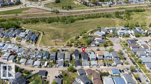 Residential neighborhood featuring detached homes with various roof colors - 29 Campbell Road, Leduc, AB - Outdoor With View
