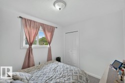 Room featuring light gray walls, white trim, and gray carpet - 